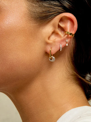MYA BAY Jazzy Rock Gold Filled Interlocking Huggie Earrings with Cubic Zirconia | LE FIGUE NEW YORK